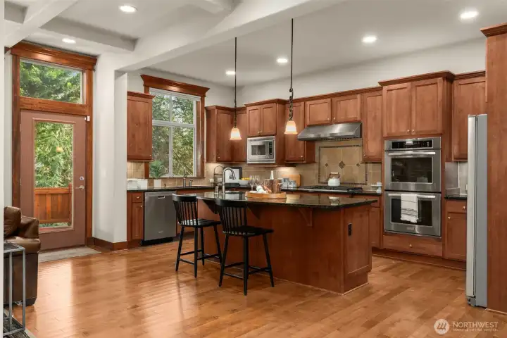 A Chef's dream of a kitchen with luxe granite, sparkling stainless & prep/storage to spare.
