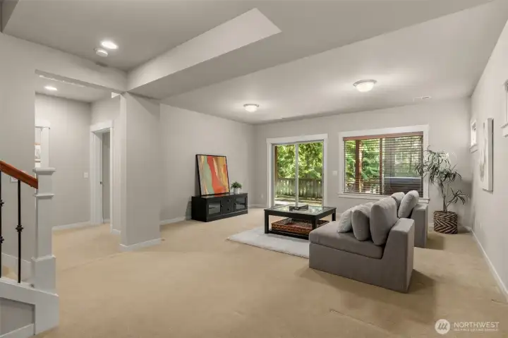 The lower-level family room is perfect for movie nights or gaming sessions.