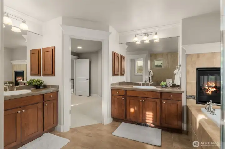 Primary bath features gas fireplace.