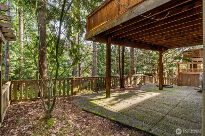 Step outside to a private backyard with patio and fire pit area—ideal for relaxing under the stars.