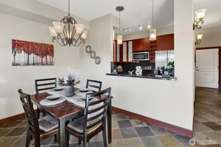 Slate tiled floors are featured in the foyer, dining, kitchen, hallways and baths.