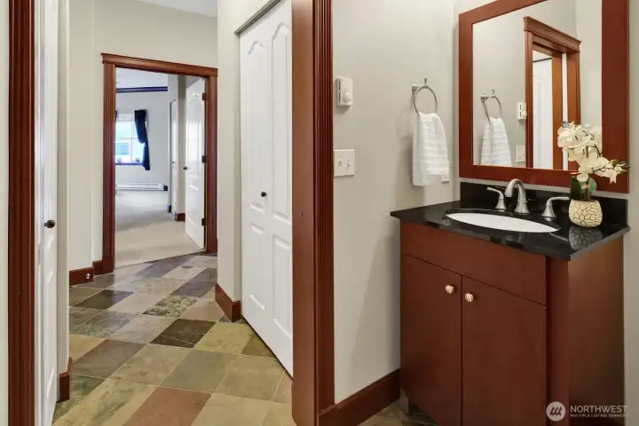 Black granite is featured on both vanities.