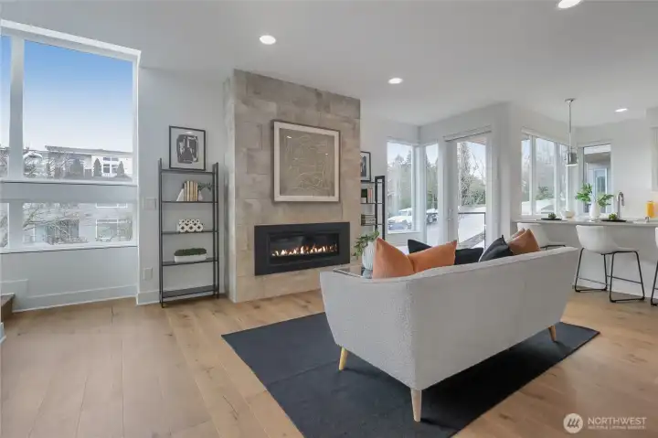 Hardwood floors harmonize with stone and natural light.