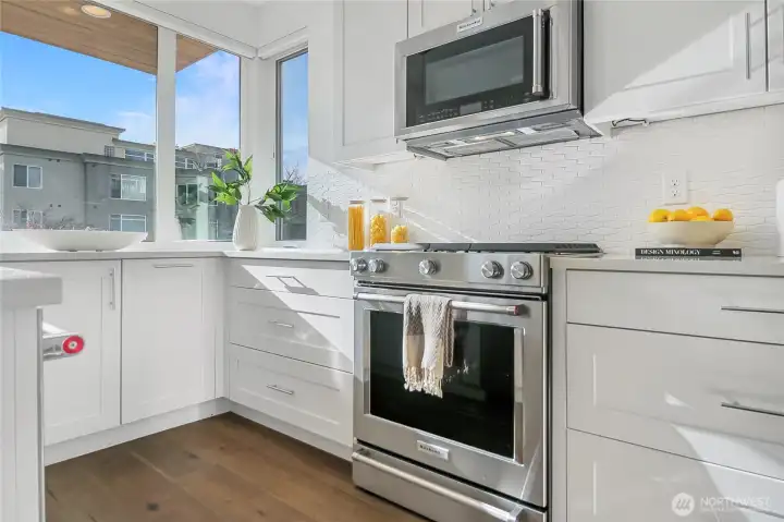 Matching high-end appliances complement the designer kitchen.