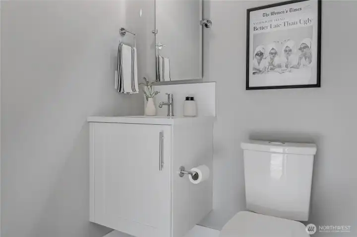 Stylish main-level powder room with modern finishes.