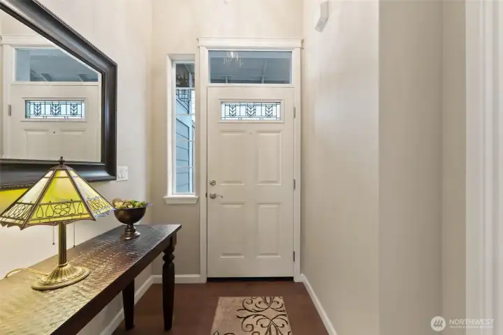 Inviting entry. What you don't see is a darling modern chandelier. All lighting fixtures throughout the house are upgrades.