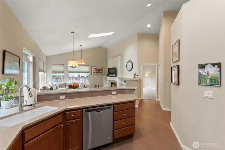 When building the owner had the wall separating the living room and hallway taken down to the same height as the mantel to open the space up even further.