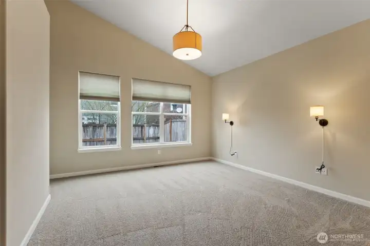 Primary bedroom. NEW CARPET AND NEW SCONCES .