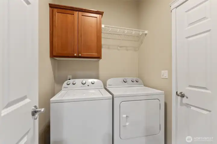 Laundry room/garage entrance. Washer and Dryer may convey with purchase.