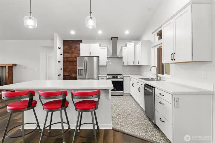 Open concept kitchen with vaulted ceilings, lots of natural light!