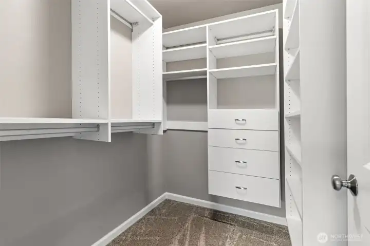 Master suite walk-in closet with shelves and drawers!