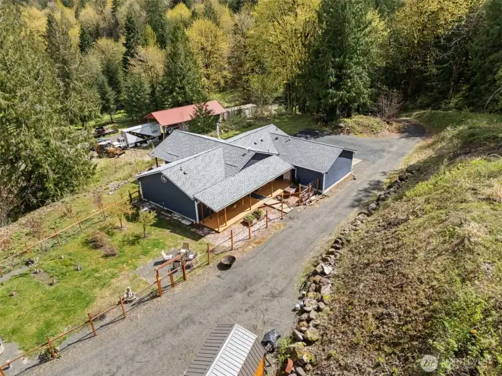 28+ acres, 2020 home, outbuildings, RV hookups, fenced garden areas and your own forest!