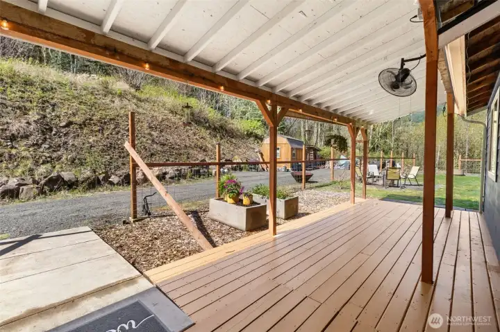 Spacious overed PATIO with fenced yard, planters, fruit trees and much more!