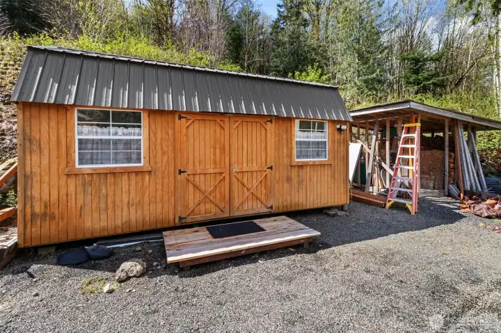 Finished - insulated - AC/Heat - 2 lofts - water outside - used for arts & crafts.  Newer Old Hickory Outbuilding!