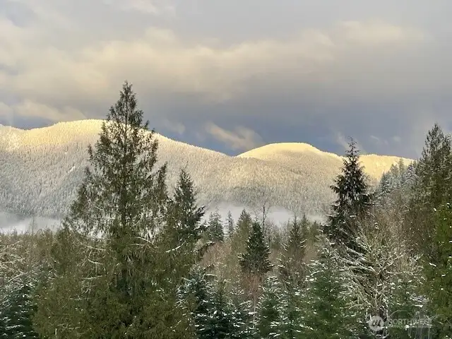 A winter view of snow capped surrounding mountains!