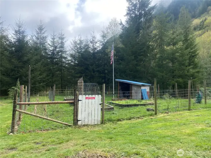 Fenced garden area with raised beds, garden shed, power & water. RV Hookup nearby!