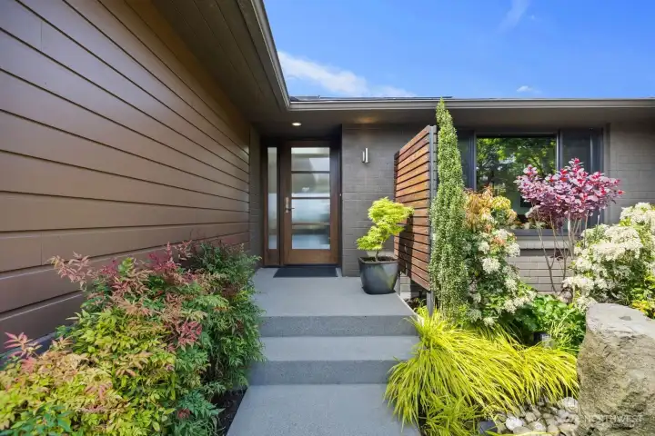 Enter this inviting space with lush plantings