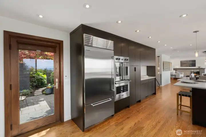 Side bar, and door leads to private patio off the kitchen