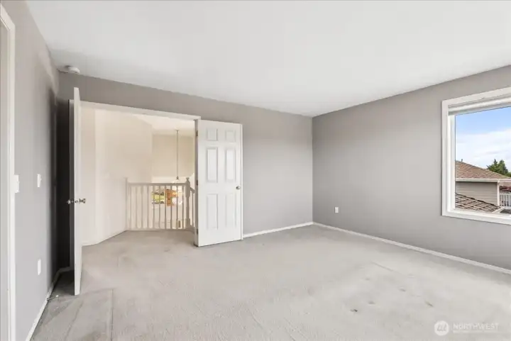 Primary bedroom with beautiful double doors.