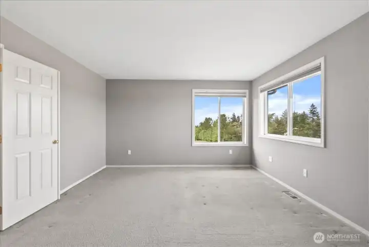 Primary bedroom.  From those windows you have a view of Puget Sound.