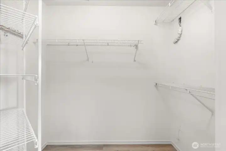 This is one of the two walk-in closets in the primary bedroom.