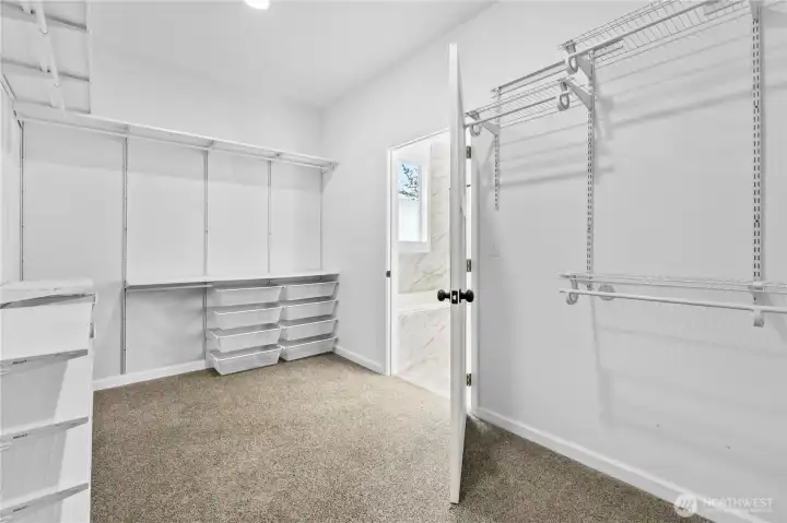 Spacious primary closet.