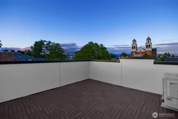 Step out onto the expansive rooftop deck, an incredible private oasis for outdoor dining and lounging. (photos are of model home, similar finishes & quality)