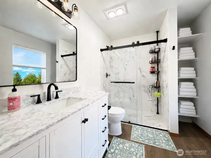 Refreshed Primary Bath with walk-in shower.