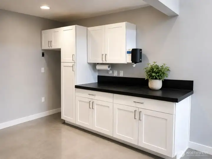 Custom white shaker cabinets for storage.