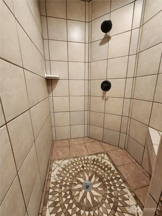 The walk in shower in the primary bathroom