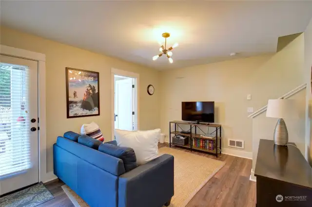 Walk out to the back yard from this media room....