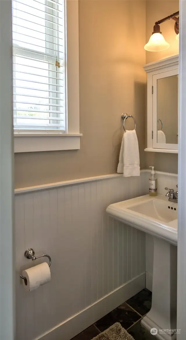 Off the entry is a guest powder room.