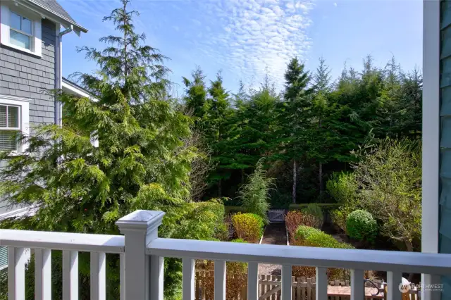 The sunny back porch is covered so even if its raining, its a lovely place to enjoy.