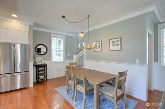 The large dining table is perfect to enjoy meals and also a great place for game night!