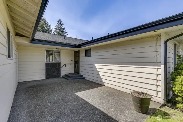 The entry patio provides another outdoor space.