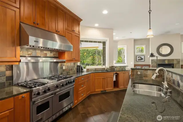 Cooking and entertaining is delightful with the Viking 6 burner range + grill + double oven, custom cabinetry and prep sink