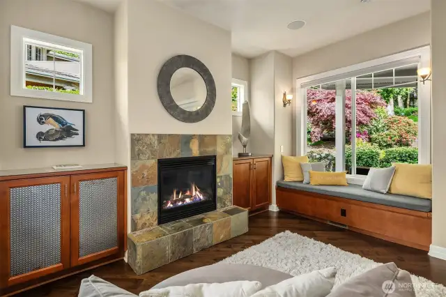 The Hearth Room (family room) off the kitchen features a built-in desk with marble top and cabinetry with air circulation to tuck your A/V equipment into. French doors lead out to a heated and covered patio!