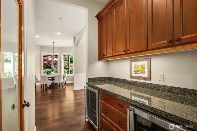Butler's pantry offers  additional custom storage, 2 beverage refrigerators and an adjacent walk in pantry!