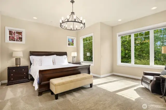 Primary Bedroom on the main level offers it's own private wing with separate office and sitting area.