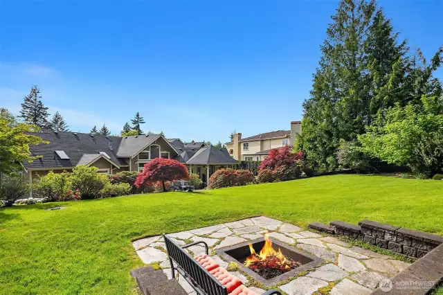 The fully landscaped shy-acre includes a lovely fire pit. 11 sprinkler zones make caring for it all easy.