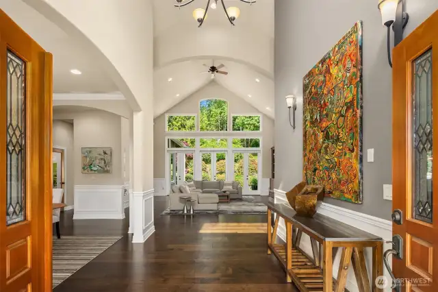 Welcome home with this extraordinary greeting! Refined finishes, impressive architectural design, lofty ceilings and serene sunny views will delight everyone who walks through these doors.