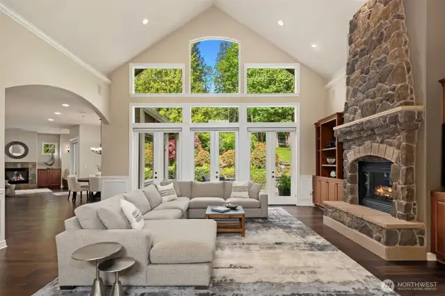 Floor to ceiling windows with three sets of French doors make indoor-outdoor living possible any time of the year! The Great Room is one of several with built in Dolby Digital 7.1 surround sound system and gas fireplace.