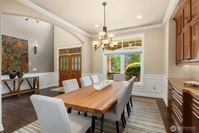 Warm hardwoods, coved ceilings, fine mill work and beautiful built-ins punctuate the formal dining room. The powder room is around the corner