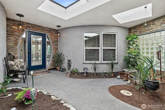 This beautiful atrium with lots of natural light with invites you in