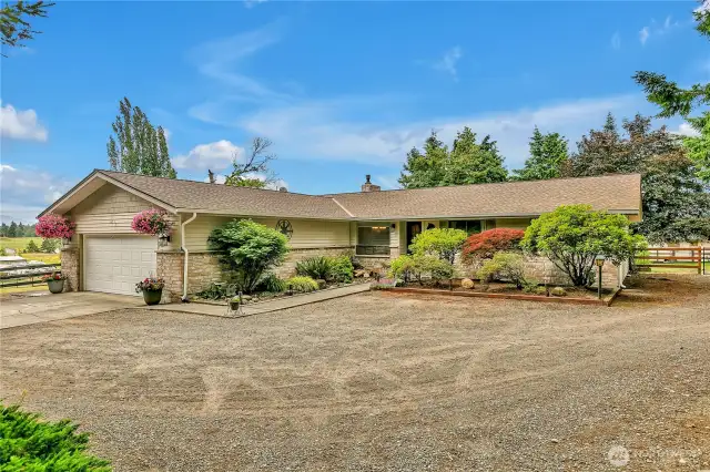 Large level entry rambler with attached garage and plenty of parking