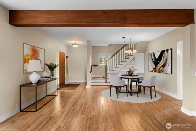 Virtual staging of dining room looking from living room.