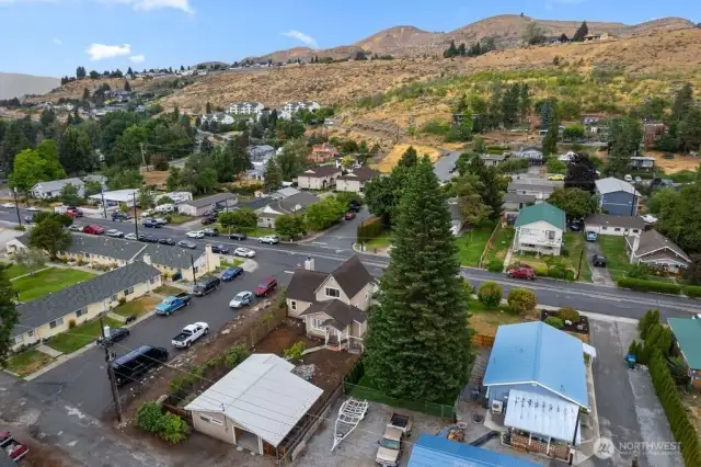 Looking from the rear/alley of the property in a drone's perspective.