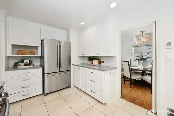 Updated kitchen has stainless steel appliances and abundant storage- pantry to the left (not shown)