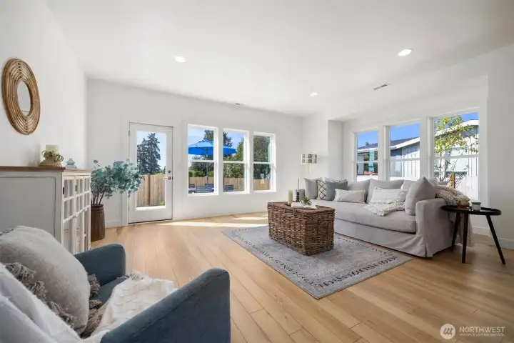 Looking across the living room toward the dining area with the kitchen beyond. This builder always has the best open floor plans!