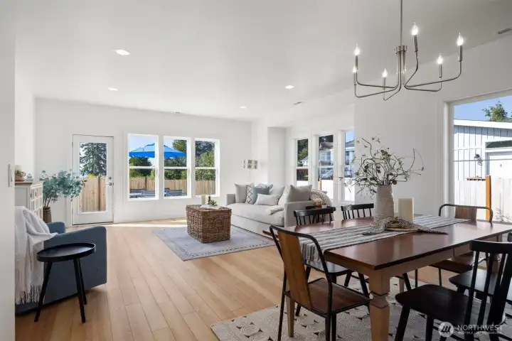 Another view across the dining area toward the living room with the water views beyond.